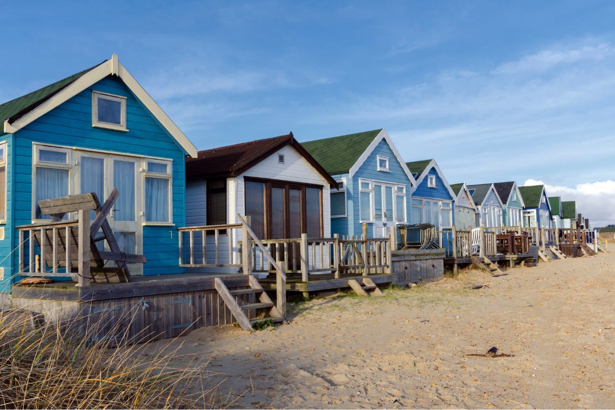 Colourful beach huts at Mudeford Sandbank on the Dorset coast.